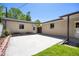 Spacious backyard with manicured lawn and brick detached garage at 2501 E Arkansas Ave, Denver, CO 80210