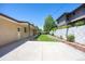 Long backyard featuring manicured lawn and brick home at 2501 E Arkansas Ave, Denver, CO 80210