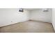 Unfinished basement with carpet, small windows and blank canvas at 2501 E Arkansas Ave, Denver, CO 80210