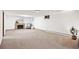 Expansive finished basement offers a brick fireplace, soft carpeting and ample space at 2501 E Arkansas Ave, Denver, CO 80210