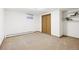 This bedroom features carpet floors, neutral walls, and a small window at 2501 E Arkansas Ave, Denver, CO 80210