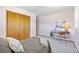 Bright bedroom showcasing closet, desk, chair, decor, carpeting, and natural light at 2501 E Arkansas Ave, Denver, CO 80210