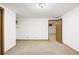 This bedroom features carpet floors, neutral walls, and built-in shelving at 2501 E Arkansas Ave, Denver, CO 80210