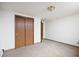 Bedroom offers natural light, a spacious closet, and neutral carpeting at 2501 E Arkansas Ave, Denver, CO 80210