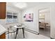 Cozy breakfast nook with a round table, art, and lots of natural light at 2501 E Arkansas Ave, Denver, CO 80210