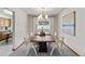 Bright dining room featuring a large wooden table with unique modern chairs and natural light at 2501 E Arkansas Ave, Denver, CO 80210