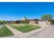 Landscaped home with a detached garage and extended driveway at 2501 E Arkansas Ave, Denver, CO 80210