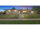 Charming single-story home with a well-maintained front yard, steps leading to the front porch, and inviting curb appeal at 2501 E Arkansas Ave, Denver, CO 80210
