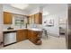 Bright kitchen with stainless steel dishwasher, ample cabinet space, and white countertops at 2501 E Arkansas Ave, Denver, CO 80210