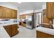 Spacious kitchen featuring stainless steel refrigerator and microwave at 2501 E Arkansas Ave, Denver, CO 80210