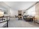 Cozy living room with a fireplace and large windows offering plenty of light at 2501 E Arkansas Ave, Denver, CO 80210