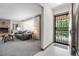 Inviting living room with a fireplace, neutral decor, and lots of natural light at 2501 E Arkansas Ave, Denver, CO 80210
