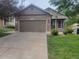 Charming single-Gathering home with a well-maintained lawn and a two-car garage, offering a welcoming curb appeal at 6123 S Quemoy Way, Aurora, CO 80015