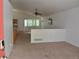 Open living room features vaulted ceilings and abundant natural light at 6123 S Quemoy Way, Aurora, CO 80015