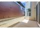 Exterior view of side yard with a concrete patio at 858 Promenade Dr, Superior, CO 80027