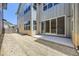 Exterior backyard featuring a concrete patio and sliding glass doors at 858 Promenade Dr, Superior, CO 80027