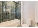 Well-lit bathroom with a tiled shower-tub combo and modern toilet at 858 Promenade Dr, Superior, CO 80027