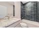 Stylish bathroom featuring granite countertop, white cabinets, and a tiled shower-tub combo at 858 Promenade Dr, Superior, CO 80027