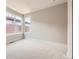 Well-lit bedroom with multiple windows, neutral paint, and plush carpet at 858 Promenade Dr, Superior, CO 80027