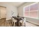 Elegant dining room with hardwood floors, modern table, and plenty of natural light at 858 Promenade Dr, Superior, CO 80027