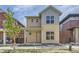 Charming two-story home featuring a covered front porch and modern design elements at 858 Promenade Dr, Superior, CO 80027