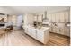 Modern kitchen featuring stainless steel appliances, center island, and ample cabinet space at 858 Promenade Dr, Superior, CO 80027