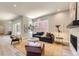 Bright living room featuring neutral walls, contemporary furnishings, and large windows at 858 Promenade Dr, Superior, CO 80027