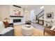 Stylish living room with a fireplace, hardwood floors, and modern staircase at 858 Promenade Dr, Superior, CO 80027