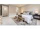 Bright main bedroom featuring neutral decor, area rug, and stylish furnishings at 858 Promenade Dr, Superior, CO 80027