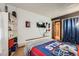 This bedroom features sports memorabilia, providing a personalized and dynamic space at 2780 S Oakland W Cir, Aurora, CO 80014