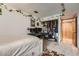 Inviting bedroom with closet, a decorative rug, plants, and a workstation setup at 2780 S Oakland W Cir, Aurora, CO 80014