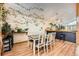 Bright dining room adjacent to the kitchen with lots of plants and view to the backyard at 2780 S Oakland W Cir, Aurora, CO 80014