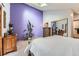 Bright main bedroom with skylight and a large closet, and a contemporary purple accent wall at 2780 S Oakland W Cir, Aurora, CO 80014