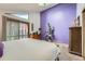 Main bedroom with vaulted ceilings, a sliding glass door and ensuite bathroom at 2780 S Oakland W Cir, Aurora, CO 80014