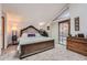 Well lit main bedroom with sliding glass door and ensuite bathroom at 2780 S Oakland W Cir, Aurora, CO 80014