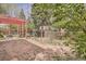 Expansive backyard featuring a pergola covered patio and a fenced yard with mature trees at 2780 S Oakland W Cir, Aurora, CO 80014