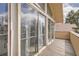 Outdoor balcony with glass sliding doors offer a view of the neighborhood at 2780 S Oakland W Cir, Aurora, CO 80014
