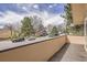 Balcony view shows the houses, cars, and trees of the neighborhood at 2780 S Oakland W Cir, Aurora, CO 80014