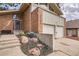 Charming brick facade home with a two-car garage, complemented by beautifully landscaped front yard at 2780 S Oakland W Cir, Aurora, CO 80014