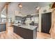 Kitchen with a large island, granite countertops, stainless steel appliances and dark colored cabinets at 2780 S Oakland W Cir, Aurora, CO 80014