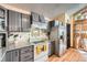 A well lit kitchen with granite countertops and stainless steel appliances at 2780 S Oakland W Cir, Aurora, CO 80014