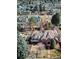 Wide aerial perspective of a brick home surrounded by lush trees, a basketball court, and a neatly kept neighborhood at 50 S Eudora St, Denver, CO 80246