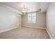 Spacious bedroom featuring neutral carpet, bright window, and contemporary lighting fixture at 50 S Eudora St, Denver, CO 80246