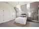 Cozy bedroom features a sloped ceiling, soft lighting, and stylish decor, creating a relaxing retreat at 50 S Eudora St, Denver, CO 80246