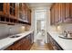 A butler pantry features plenty of storage space and white countertops at 50 S Eudora St, Denver, CO 80246