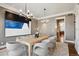 Formal dining room with neutral colors and a view of the hallway and kitchen at 50 S Eudora St, Denver, CO 80246