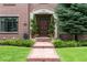 Inviting front entrance with a brick pathway leading to the elegant wooden front door at 50 S Eudora St, Denver, CO 80246