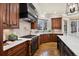 Gourmet kitchen featuring custom cabinets, a professional range, and pristine countertops at 50 S Eudora St, Denver, CO 80246