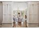 Bright living room featuring decorative columns, a fireplace, and large windows at 50 S Eudora St, Denver, CO 80246
