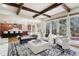 Open-concept living room with seamless flow to the kitchen, dining, and outdoor spaces at 50 S Eudora St, Denver, CO 80246